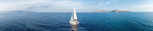 Sailing catamaran in full sail