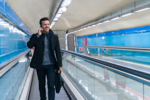 Portrait of middle-aged Caucasian businessman walking down the subway commuting to work