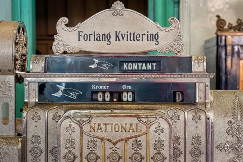 Antique mechanical cash register with lettering national shows the amount zero