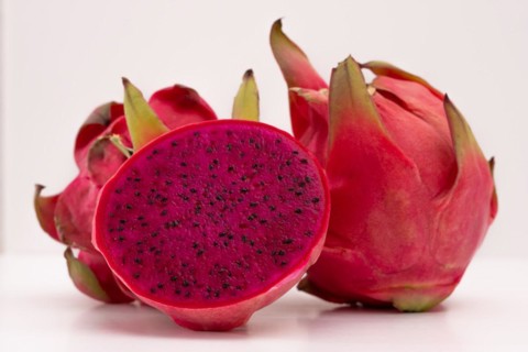Pink pitahaya or dragon fruit isolated on white background with copy-space