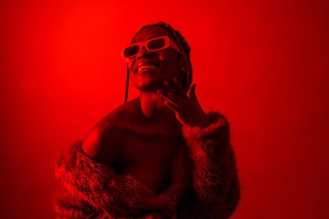Attractive black ethnic woman with braids with red led lights