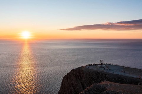 Steel globe at the North Cape under the midnight sun