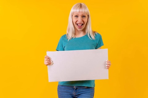 Holding white empty advertisement poster