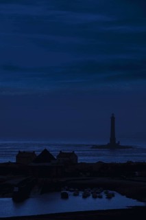Lighthouse and lifeboat station in the Goury port near Auderville at the Cap de La Hague at night