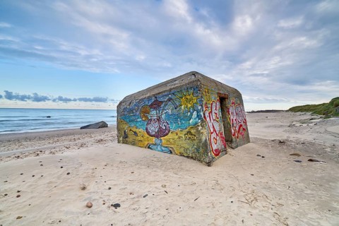 Beautiful white sandy beach with a bunker