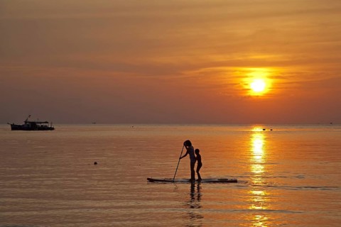 Mother and child standup paddleboarding