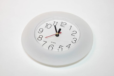 Wall clock shows 5 to 12