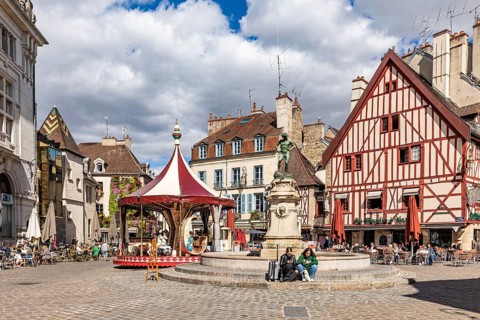 Fountains and restaurants at Place Francois Rude in the old town
