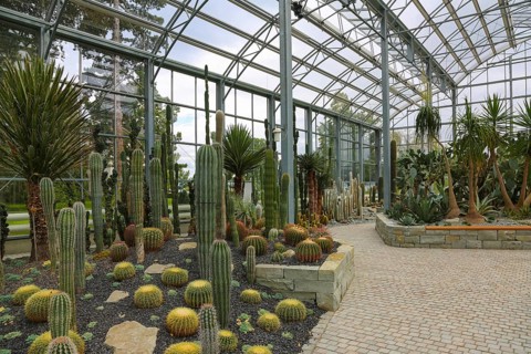 Glass plant house in the villa gardens by the lake