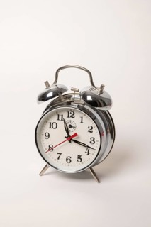 Metal alarm clock with mechanical clockwork and bell mechanism
