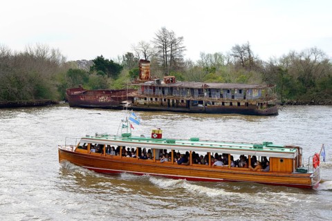 Excursion boat and shipwreck on the Rio Lujan
