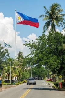 National Flag Flag of Philippines flies on long flagpole in until 1991 former US Naval Base of United States Navy in Subic Bay