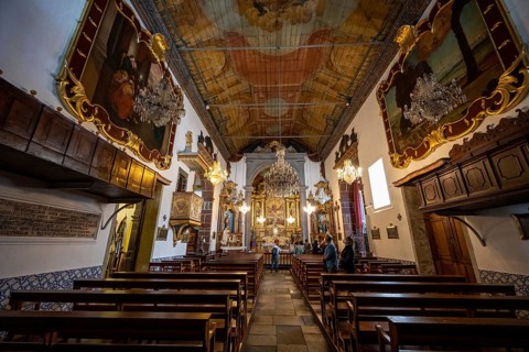 Interior with pews and ceiling painting