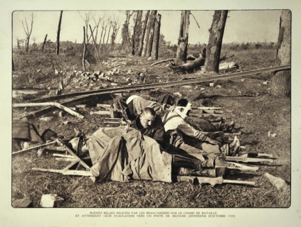 Wounded soldiers on stretchers waiting for evacuation from the battlefield in Flanders during the First World War