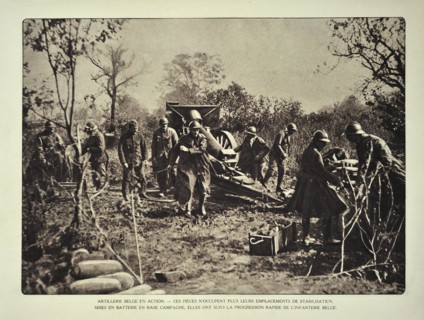 Artillery soldiers firing cannon at battlefield in Flanders during the First World War