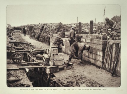 Soldiers repairing bombed shelter in trench at battlefield in Flanders during the First World War
