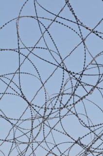 Razor wire on top of the DMZ
