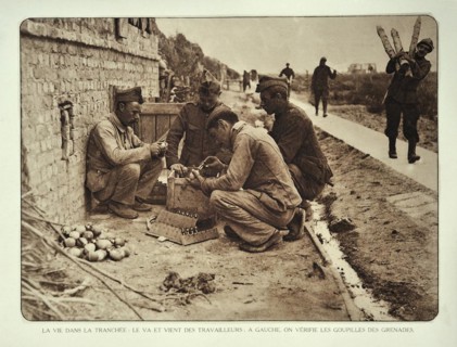 Soldiers checking the pins in hand grenades in Flanders during the First World War