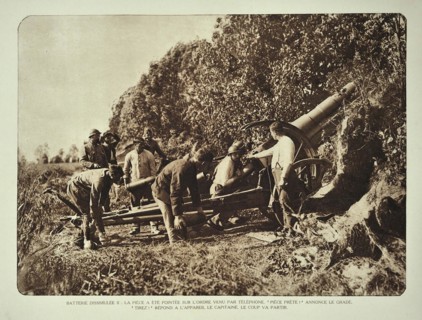 Artillery soldiers firing battery cannon from behind camouflage screen towards battlefield in Flanders during the WWI