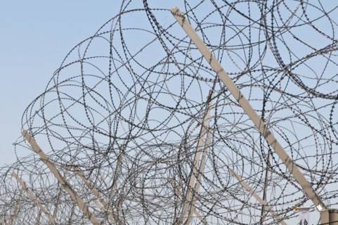 Razor wire on top of the DMZ
