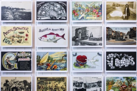 Collection of vintage postcards of the early 20th century showing drawings and old photographs of holiday destinations
