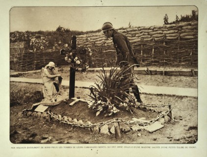 Soldier visiting grave in trench in Flanders during the First World War