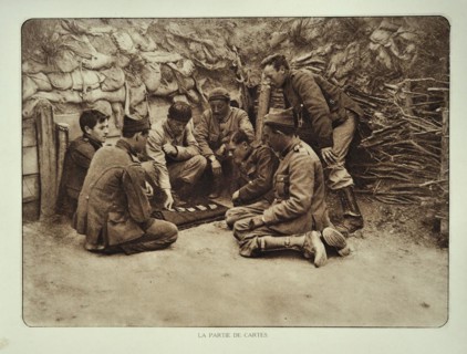 Soldiers at rest playing cards in trench in Flanders during the First World War