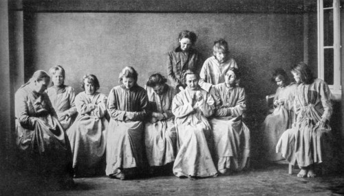 Vintage black and white photograph showing group of schizophrenic women suffering from the mental illness schizophrenia