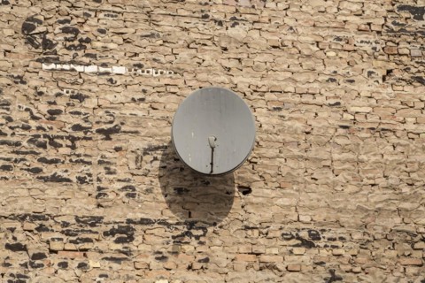 Satellite dish on a wall