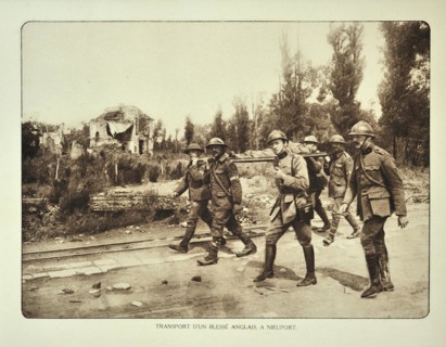 Transport of wounded English soldier on stretcher at Nieuwpoort in Flanders during the First World War