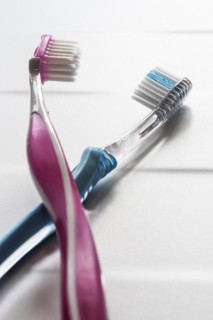His and hers pink and blue toothbrushes