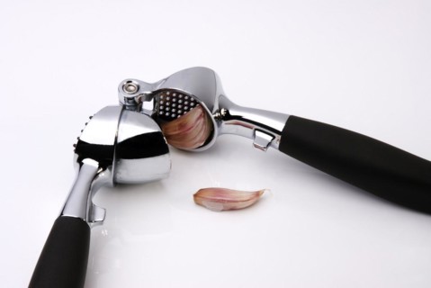 Garlic Press crushing a clove