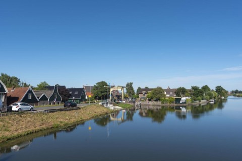 Village scene with canal bridge at the Drechterlandsdijk