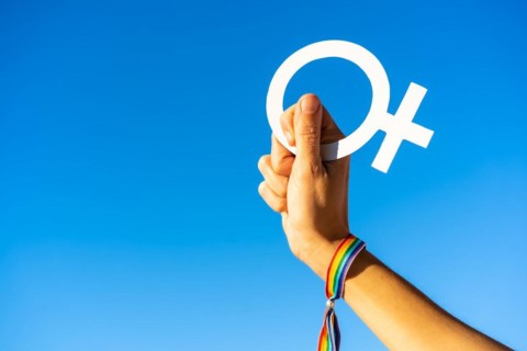 Hand of a woman with female symbol in favor of feminism