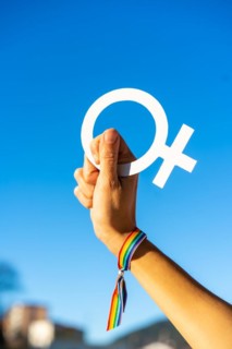 Hand of a woman with female symbol in favor of feminism