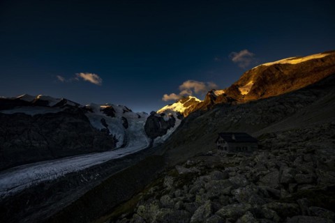 Morteratsch glacier with Boval hut in Bernina group at sunrise
