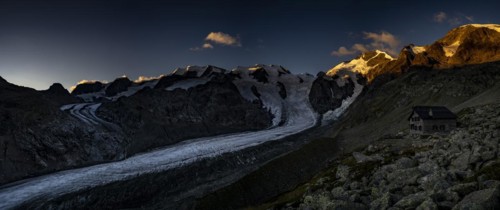 Morteratsch glacier with Boval hut in Bernina group at sunrise