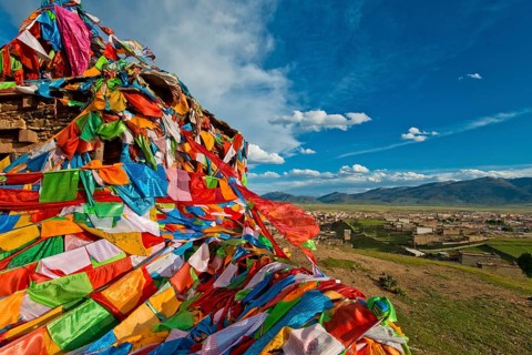 Prayer flags near Litang Tibetan Buddhist Monastery overlooking the town