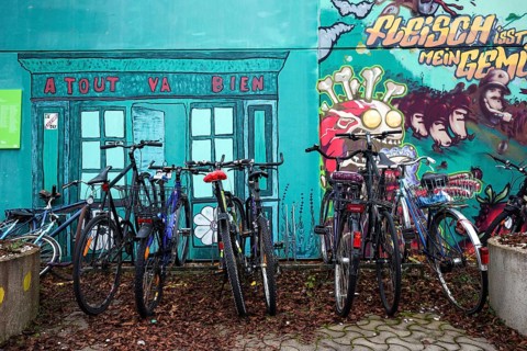 Bicycles in front of mural in the former Olympic Village