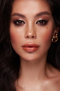Beautiful Asian brunette model with volume curls