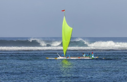 Brightly painted fishing outriggers on the beach at Sanur