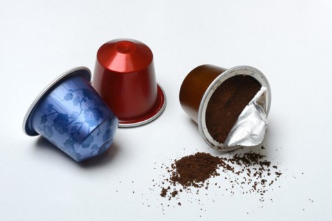 Opened coffee capsule and coffee powder