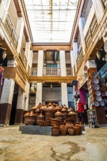 Shop in the courtyard with traditional tajine pot in the middle