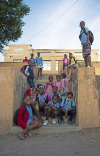 Schoolchildren in uniform in front of the village school in Rui Vaz