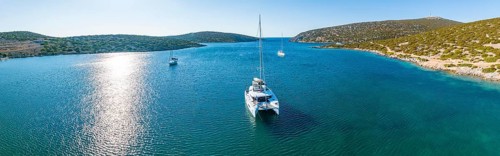 Sailing catamaran in a bay