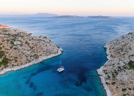 Sailing catamaran in a bay of Levitha Island
