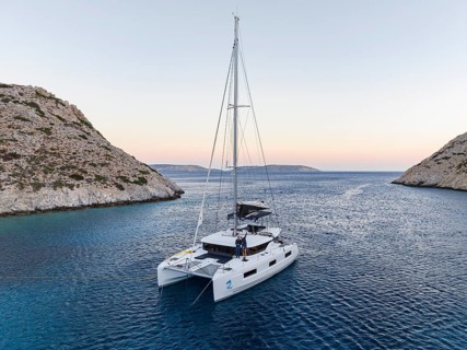 Sailing catamaran in a bay of Levitha Island