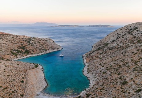 Sailing catamaran in a bay of Levitha Island