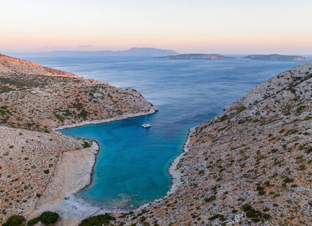 Sailing catamaran in a bay of Levitha Island