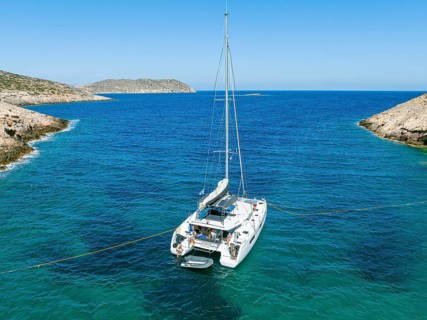 Sailing catamaran with shore lines